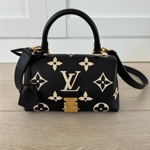 LOUIS VUITTON
Empreinte Monogram Giant Madeleine BB Black Beige